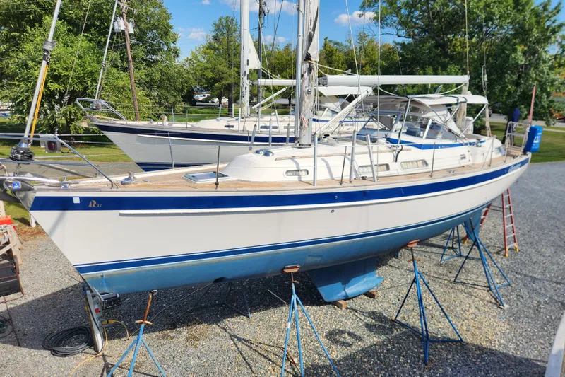 Glendora Yacht Photos Pics 2007 Hallberg-Rassy 37 sailboat on stands, displayed outdoors under a clear sky.