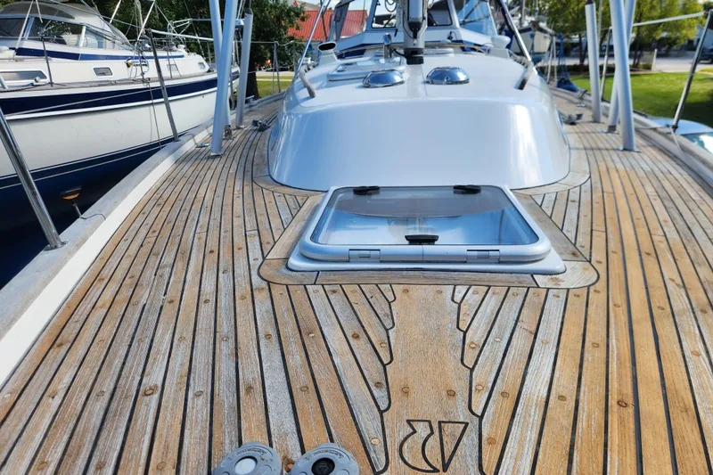 Glendora Yacht Photos Pics Deck view of a 2007 Hallberg-Rassy 37 sailboat with open hatch.