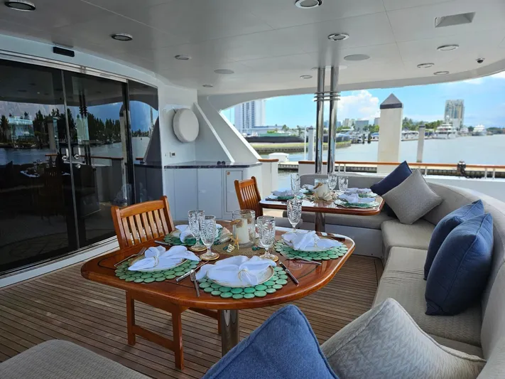 Miss Stephanie Yacht Photos Pics Luxurious dining area on a 2004 Richmond Yachts Semi-Displacement, featuring elegant table settings.