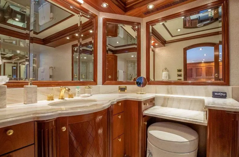 Miss Stephanie Yacht Photos Pics Luxurious yacht bathroom with elegant wood cabinetry and marble countertops, Richmond Yachts 2004 model.