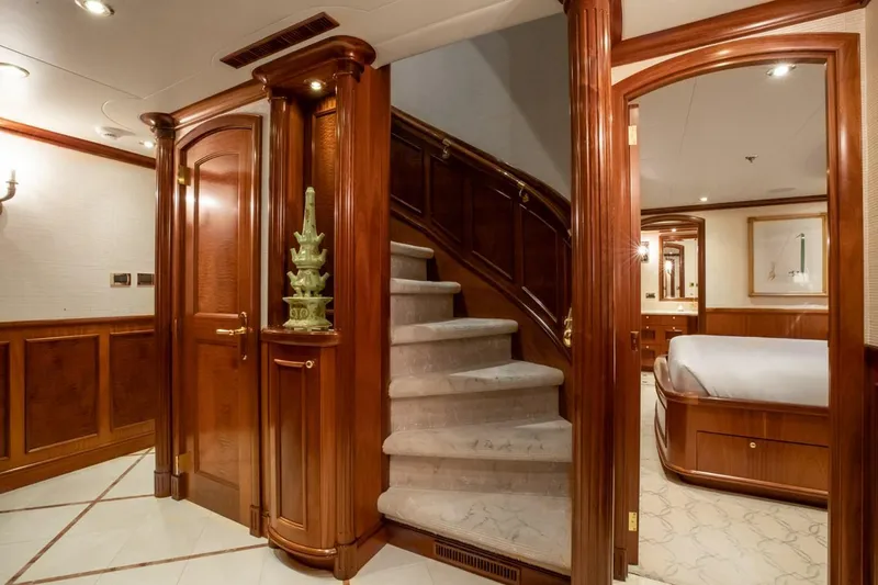 Miss Stephanie Yacht Photos Pics Luxurious Richmond Yachts 2004 interior with elegant wood paneling and plush carpeted staircase.