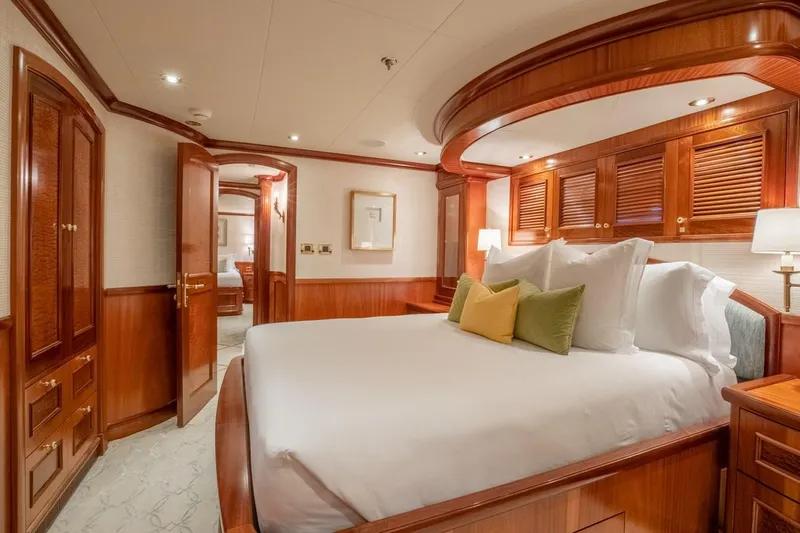 Miss Stephanie Yacht Photos Pics Luxurious Richmond Yachts 2004 bedroom with elegant wood paneling and plush bedding.