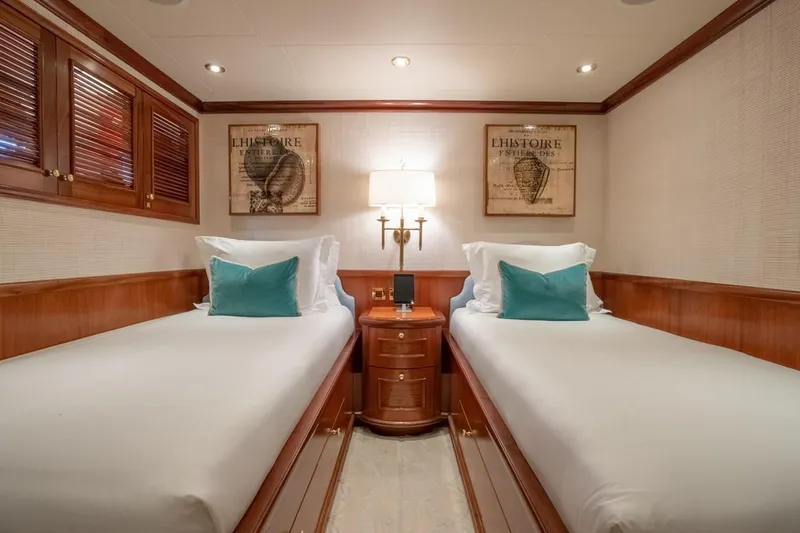Miss Stephanie Yacht Photos Pics Luxurious twin cabin on 2004 Richmond Yachts Semi-Displacement, featuring elegant wood finishes.