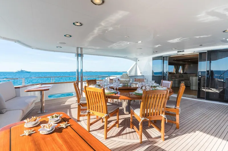 Miss Stephanie Yacht Photos Pics Luxurious 2004 Richmond Yachts semi-displacement deck with elegant dining area and ocean view.