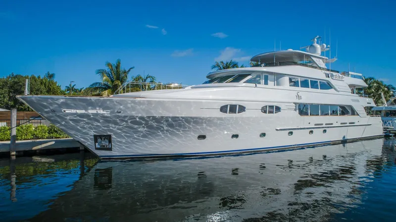 Miss Stephanie Yacht Photos Pics Richmond Yachts 2004 semi-displacement yacht docked, reflecting on calm water.