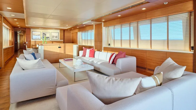 Kintaro Yacht Photos Pics Luxurious interior of 2005 Cantieri di Pisa Akhir 38 yacht with modern furnishings and large windows.