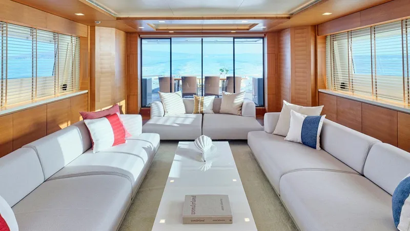 Kintaro Yacht Photos Pics Luxurious interior of 2005 Cantieri di Pisa Akhir 38 yacht with elegant seating and ocean view.