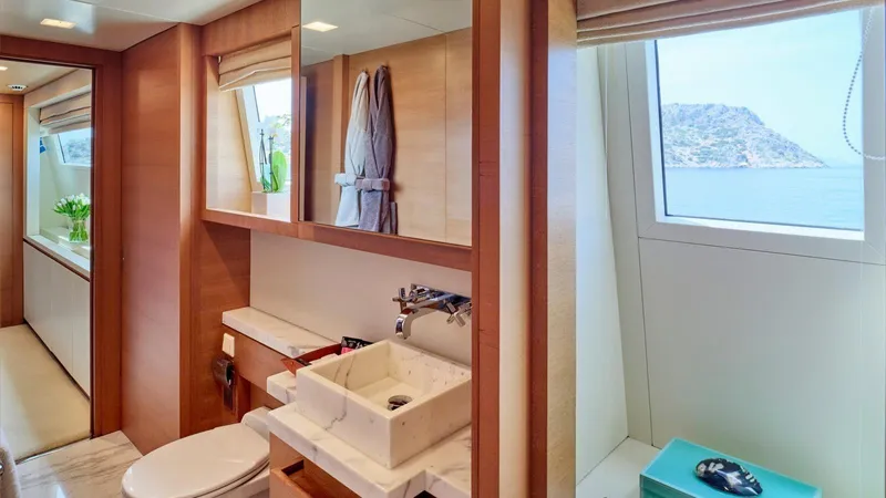 Kintaro Yacht Photos Pics Luxurious bathroom interior on 2005 Cantieri di Pisa Akhir 38 yacht with ocean view.