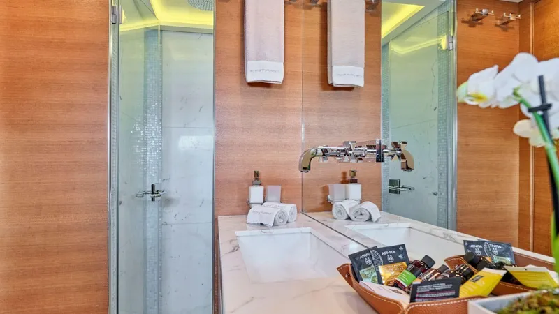 Kintaro Yacht Photos Pics Luxurious bathroom on 2005 Cantieri di Pisa Akhir 38 yacht with modern fixtures and amenities.