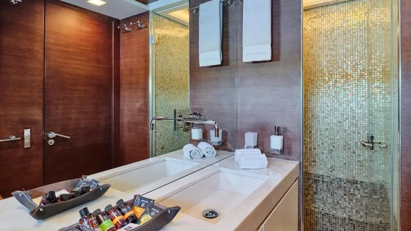 Kintaro Yacht Photos Pics Luxurious bathroom on 2005 Cantieri di Pisa Akhir 38 yacht with modern fixtures and amenities.