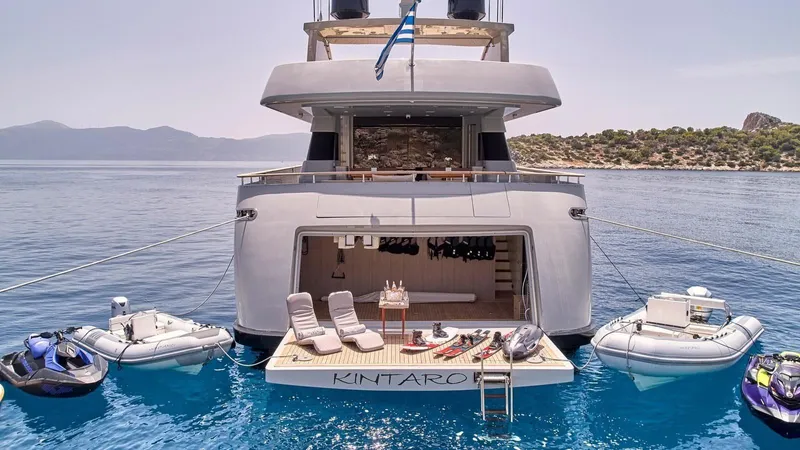 Kintaro Yacht Photos Pics Luxury yacht Cantieri di Pisa Akhir 38, 2005, with sun deck and water toys in serene waters.