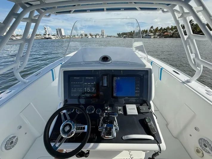  Yacht Photos Pics Cockpit view of 2012 Midnight Express 37 Open boat with advanced navigation system.