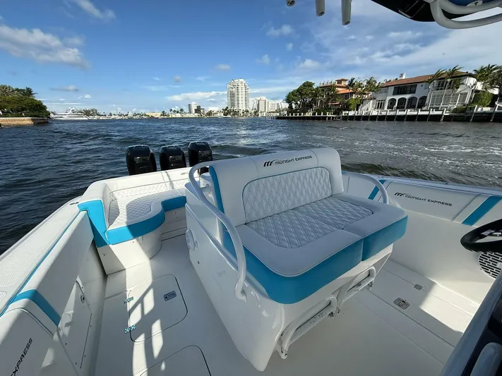  Yacht Photos Pics 2012 Midnight Express 37 Open boat interior with blue and white seating, on a sunny day.