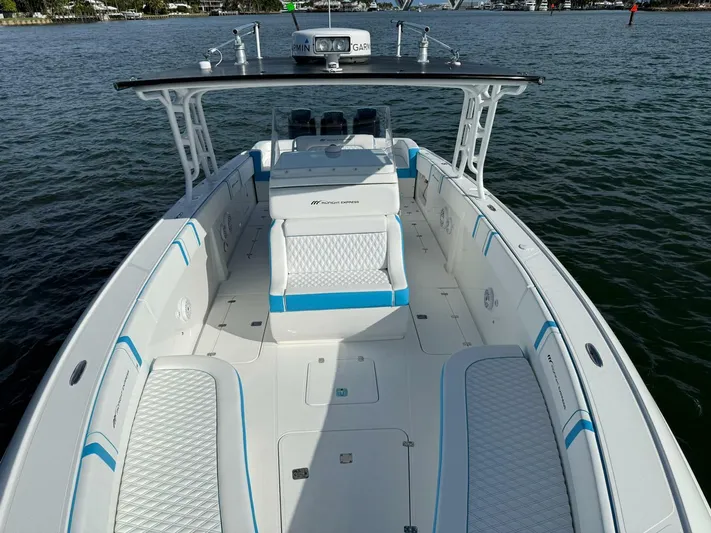  Yacht Photos Pics 2012 Midnight Express 37 Open boat with spacious seating on calm water.