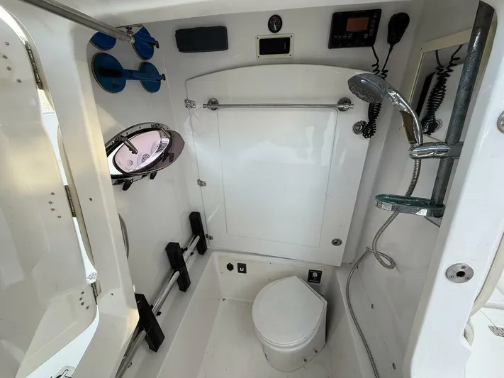  Yacht Photos Pics Interior of 2012 Midnight Express 37 Open boat bathroom with shower and toilet.