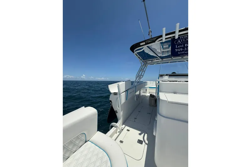  Yacht Photos Pics 2012 Midnight Express 37 Open boat on open sea, clear sky, spacious deck.