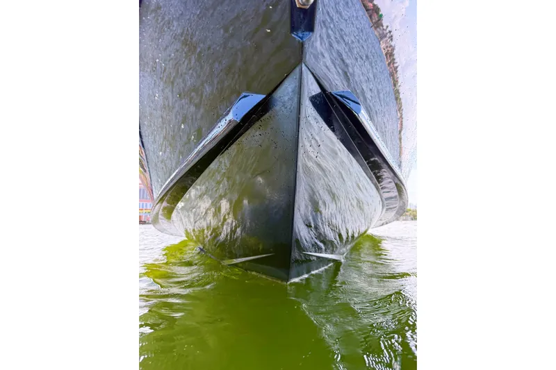  Yacht Photos Pics Close-up of 2012 Midnight Express 37 Open boat hull in water.