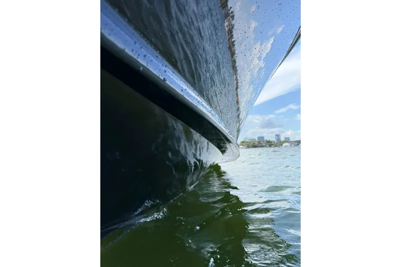  Yacht Photos Pics Close-up of 2012 Midnight Express 37 Open boat hull on water.