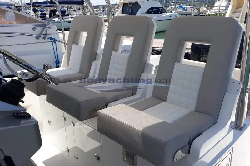  Yacht Photos Pics Three cushioned seats on a 2017 3B Craft 330 CC boat.