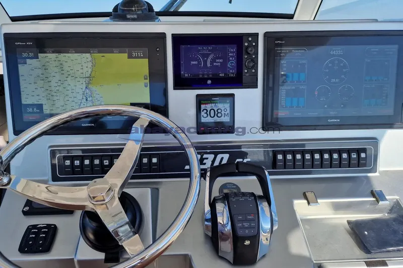  Yacht Photos Pics Cockpit of 2017 3B Craft 330 CC with Garmin navigation displays and steering wheel.
