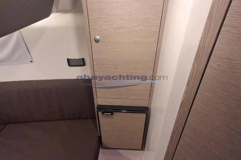  Yacht Photos Pics Interior of 2017 3B Craft 330 CC yacht with wooden cabinetry and seating.