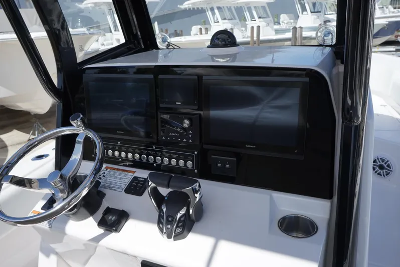  Yacht Photos Pics 2025 Sea Fox 282 Hybrid LT boat dashboard with steering wheel and electronic displays.