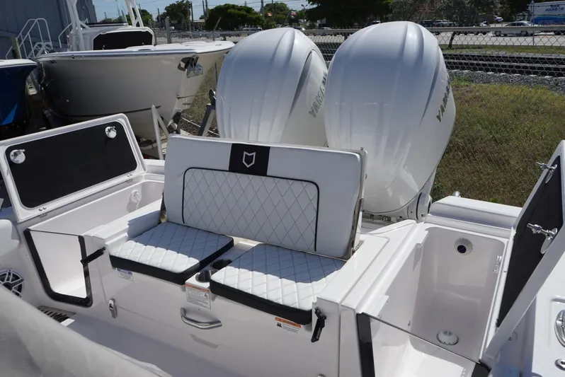  Yacht Photos Pics 2025 Sea Fox 282 Hybrid LT boat with dual outboard engines and cushioned seating.