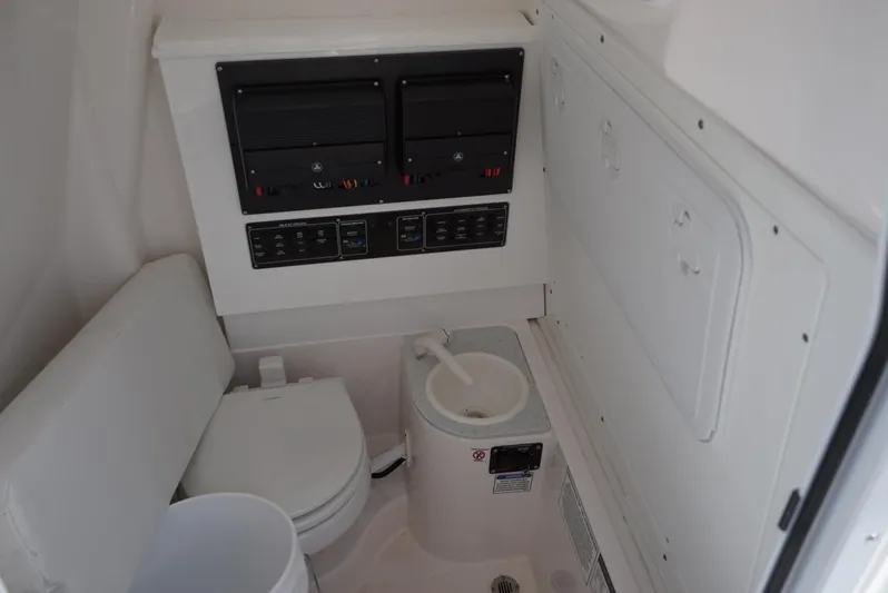  Yacht Photos Pics Interior of 2025 Sea Fox 282 Hybrid LT boat featuring a compact marine toilet.