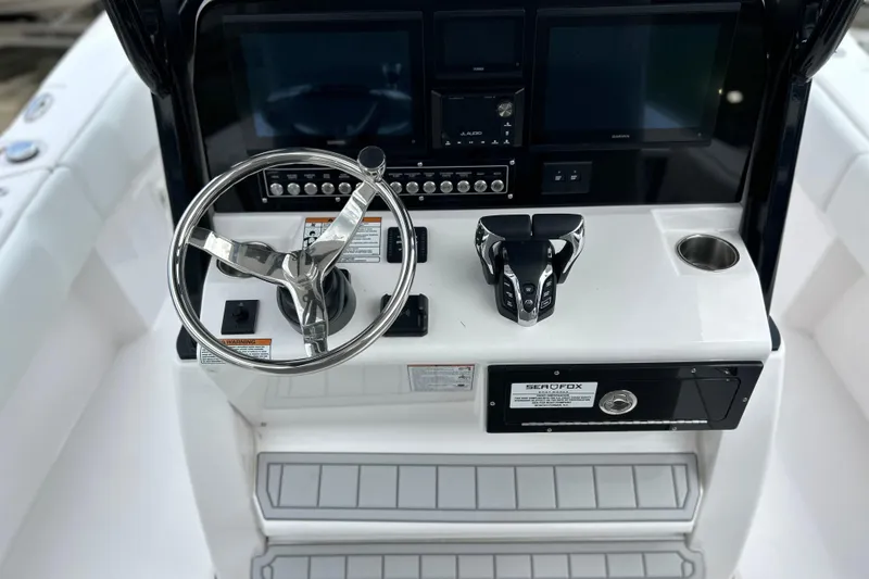  Yacht Photos Pics 2025 Sea Fox 282 Hybrid LT boat console with steering wheel and controls.