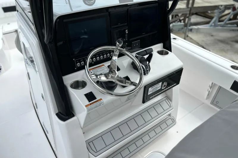 Yacht Photos Pics 2025 Sea Fox 282 Hybrid LT boat helm with steering wheel and control panel.