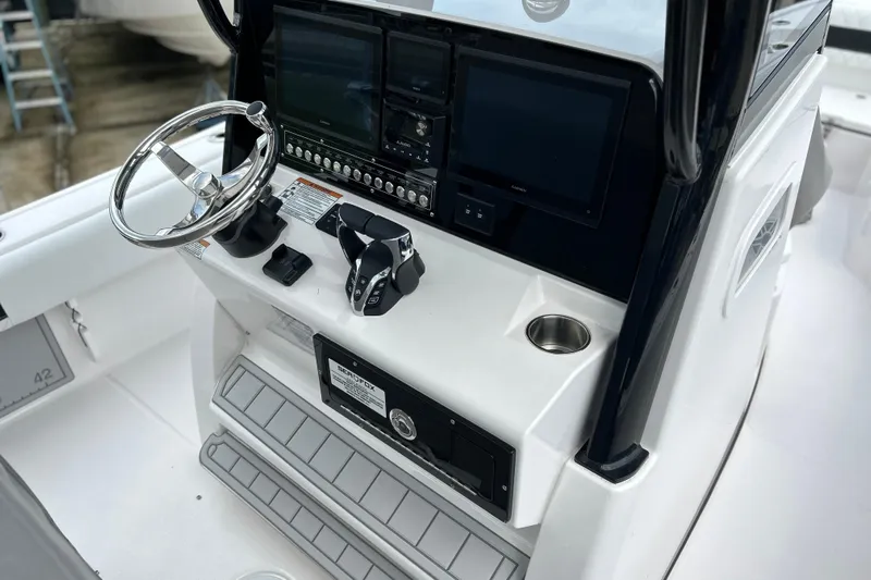  Yacht Photos Pics 2025 Sea Fox 282 Hybrid LT boat console with steering wheel and electronic controls.