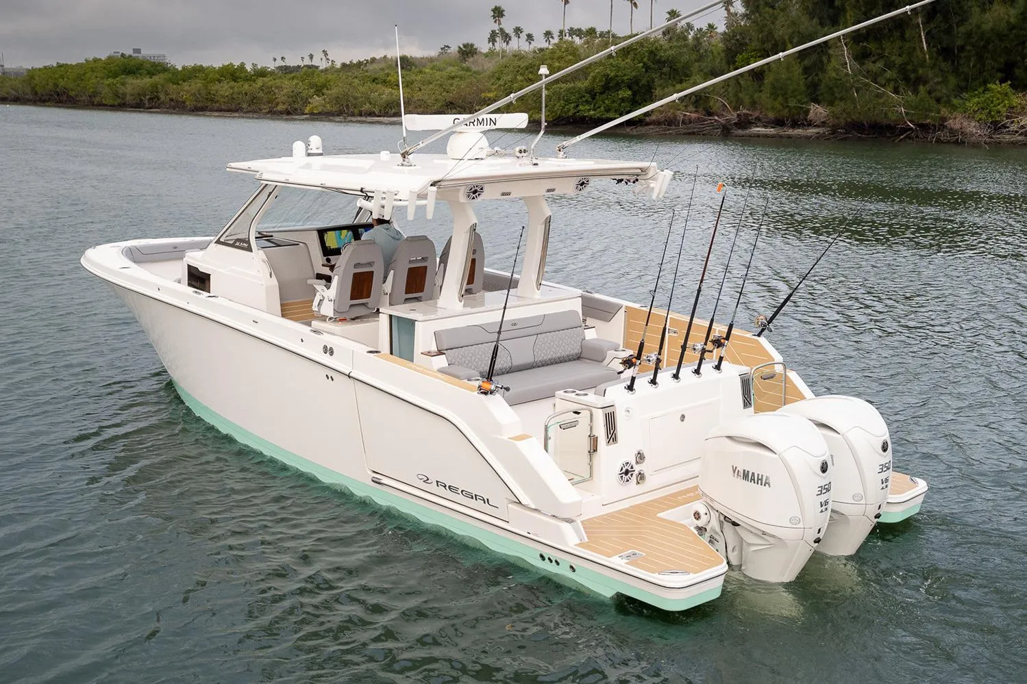 Manufacturer Provided Image: 2026 Regal 34 SAV boat with dual Yamaha engines on calm water.