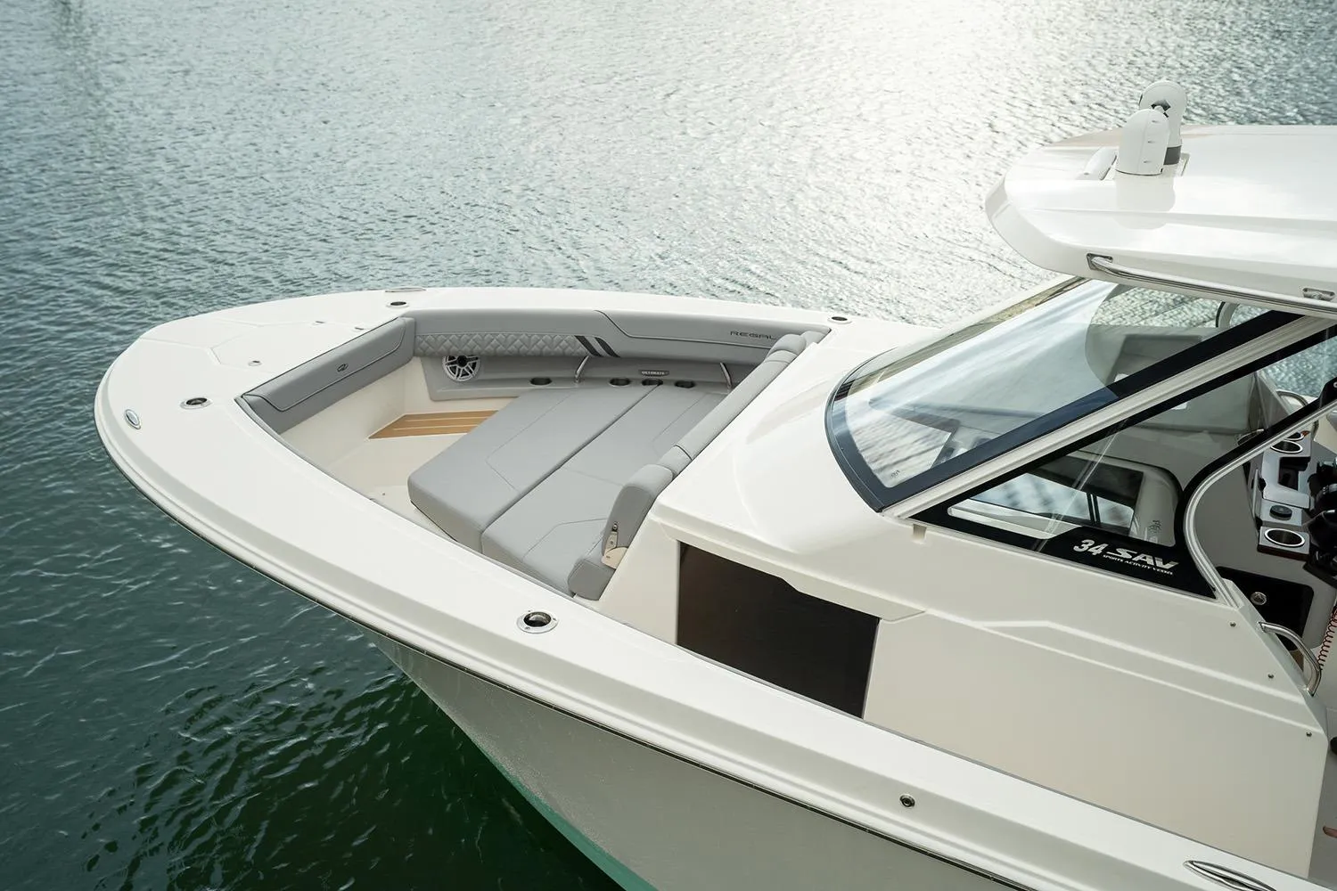 Manufacturer Provided Image: 2026 Regal 34 SAV boat with sleek design and spacious seating on calm water.