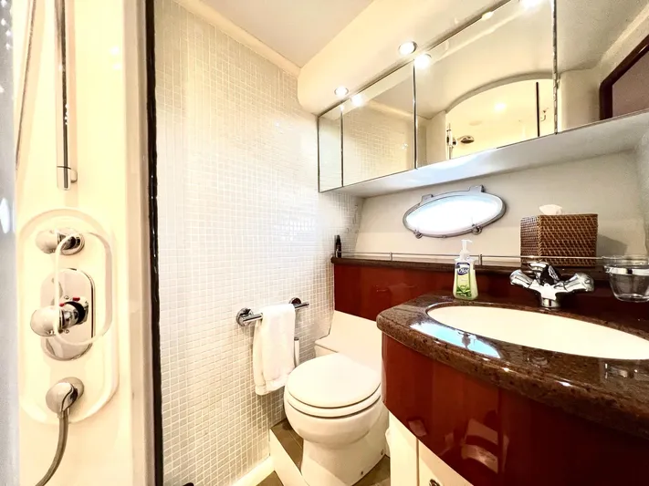 Por Fin Yacht Photos Pics Luxurious bathroom in a 1999 Fairline Squadron 65 yacht with modern fixtures.