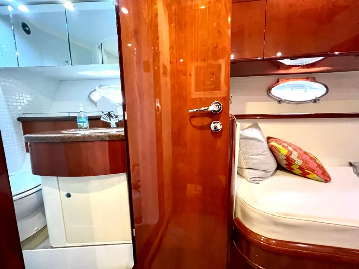 Por Fin Yacht Photos Pics Interior of 1999 Fairline Squadron 65 yacht with wooden finishes and cozy cabin.