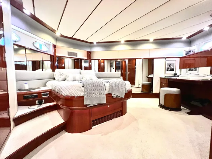 Por Fin Yacht Photos Pics Luxurious master bedroom on 1999 Fairline Squadron 65 yacht with elegant wood finishes.