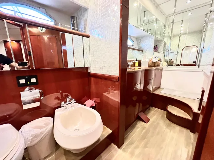 Por Fin Yacht Photos Pics Luxurious bathroom in a 1999 Fairline Squadron 65 yacht with modern fixtures.