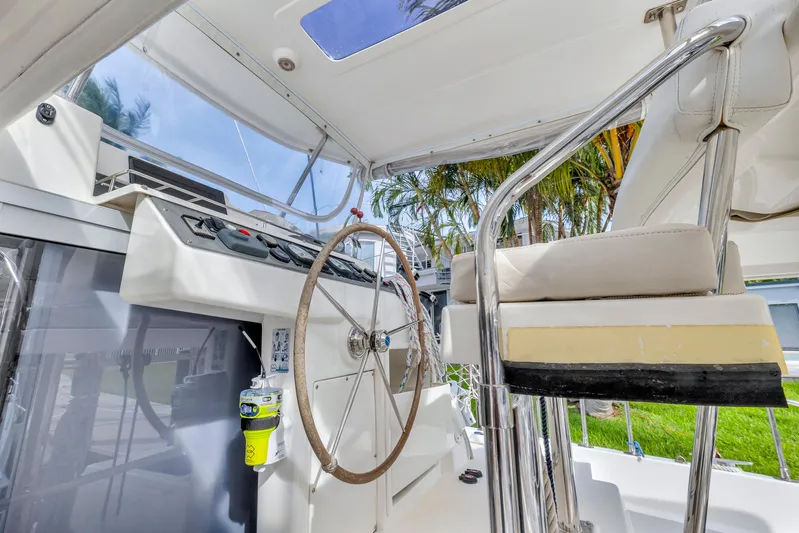  Yacht Photos Pics Helm of 2017 Leopard 40 catamaran with steering wheel and cockpit seating.