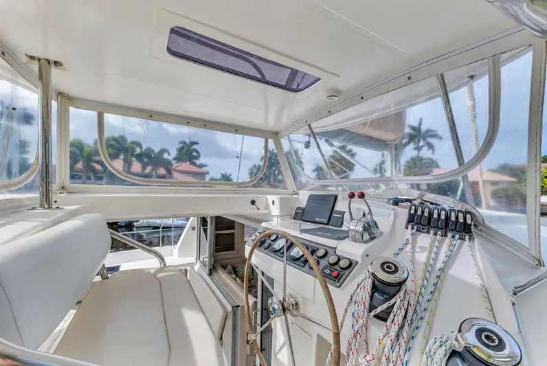  Yacht Photos Pics Interior view of 2017 Leopard 40 catamaran cockpit with steering wheel and navigation equipment.