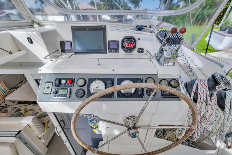  Yacht Photos Pics Helm of 2017 Leopard 40 catamaran with navigation instruments and steering wheel.