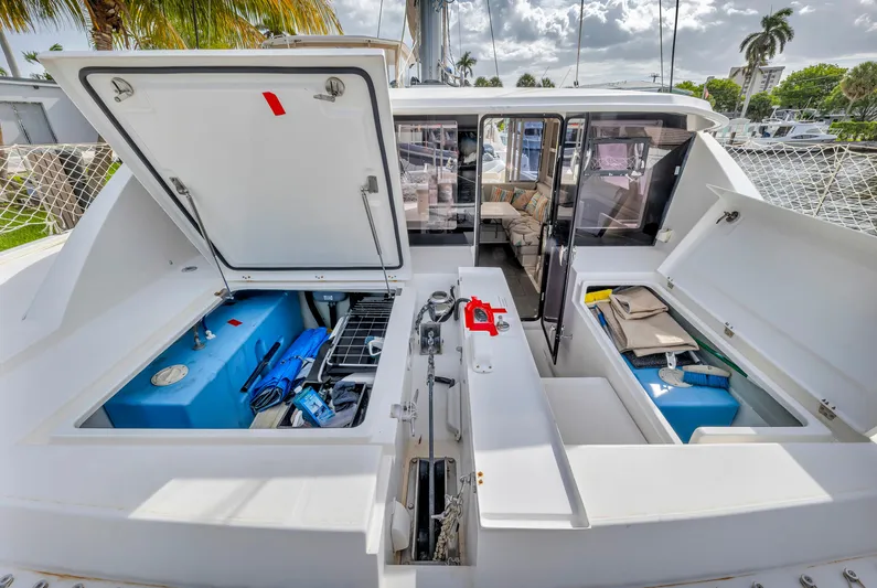  Yacht Photos Pics 2017 Leopard 40 catamaran deck with open storage compartments and visible equipment.