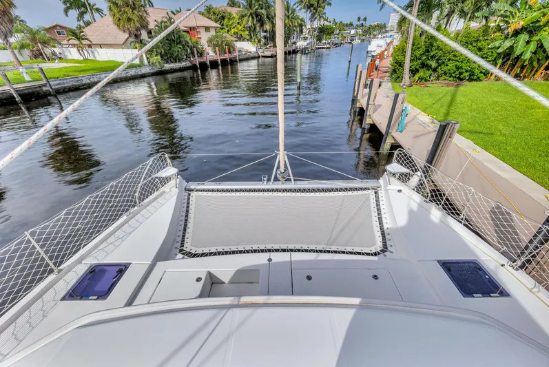  Yacht Photos Pics Front deck of 2017 Leopard 40 catamaran docked by a scenic canal.