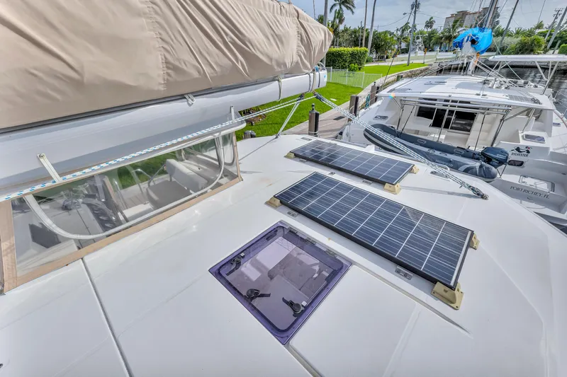  Yacht Photos Pics Leopard 40 catamaran (2017) with solar panels on deck, docked in a marina.