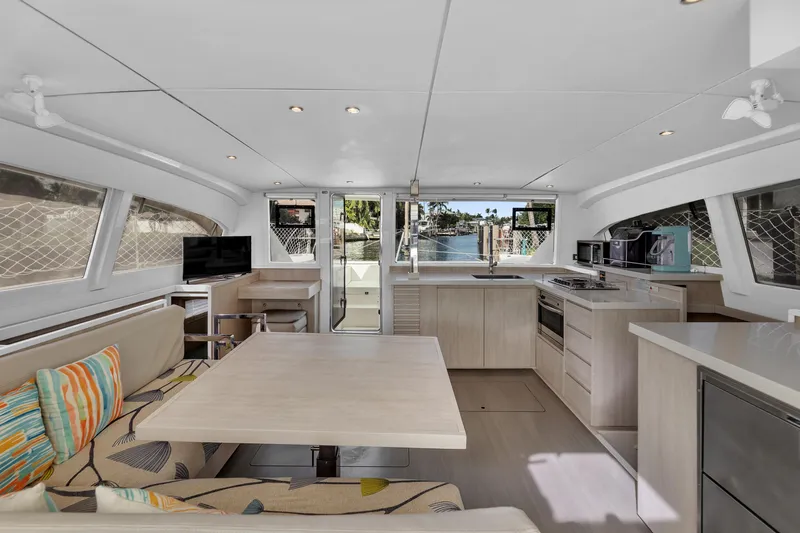  Yacht Photos Pics Spacious interior of 2017 Leopard 40 catamaran with modern kitchen and dining area.