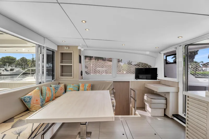  Yacht Photos Pics Interior of 2017 Leopard 40 catamaran with modern seating and dining area.