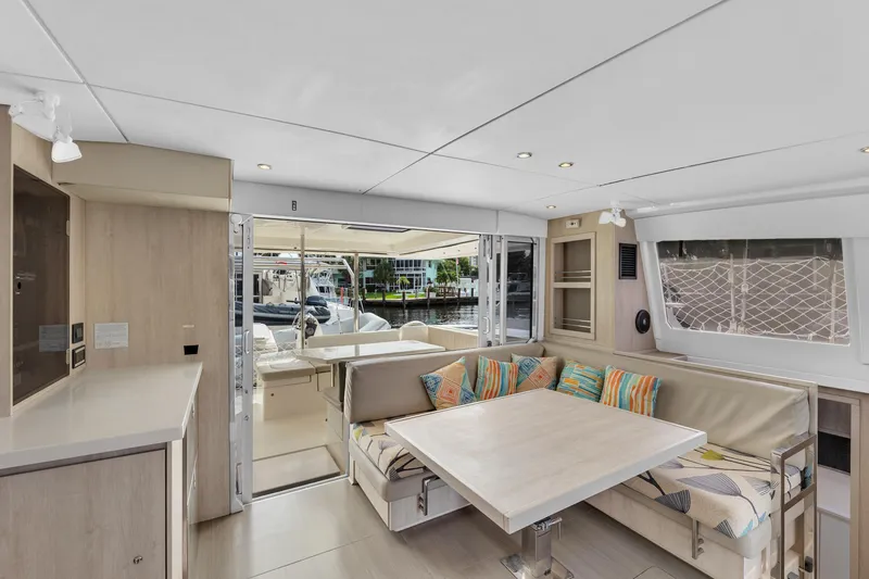  Yacht Photos Pics Interior of 2017 Leopard 40 catamaran with modern seating and dining area.