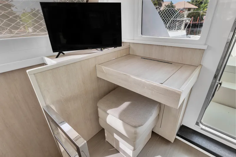  Yacht Photos Pics Interior of 2017 Leopard 40 yacht with TV and compact desk area.