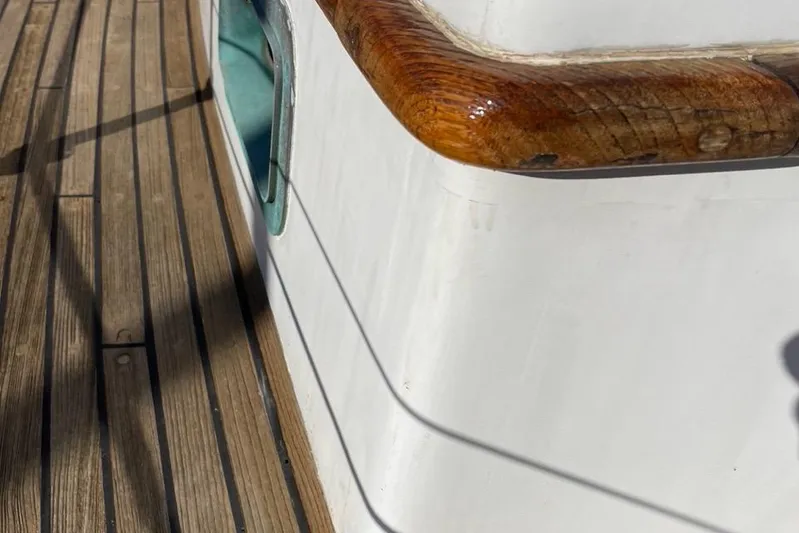 Begonia Yacht Photos Pics Wooden deck and railing of 1988 Custom Atkin & Lange Cutter sailboat.