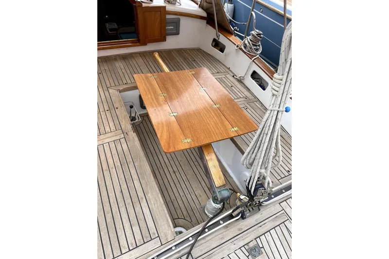 Begonia Yacht Photos Pics Wooden deck of 1988 Custom Atkin & Lange Cutter with foldable table and ropes.