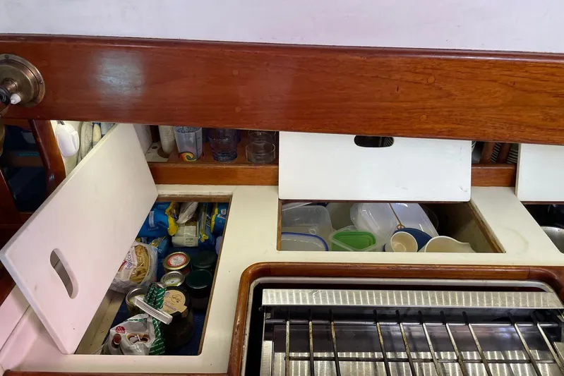 Begonia Yacht Photos Pics Interior storage of 1988 Custom Atkin & Lange Cutter with organized kitchen supplies.
